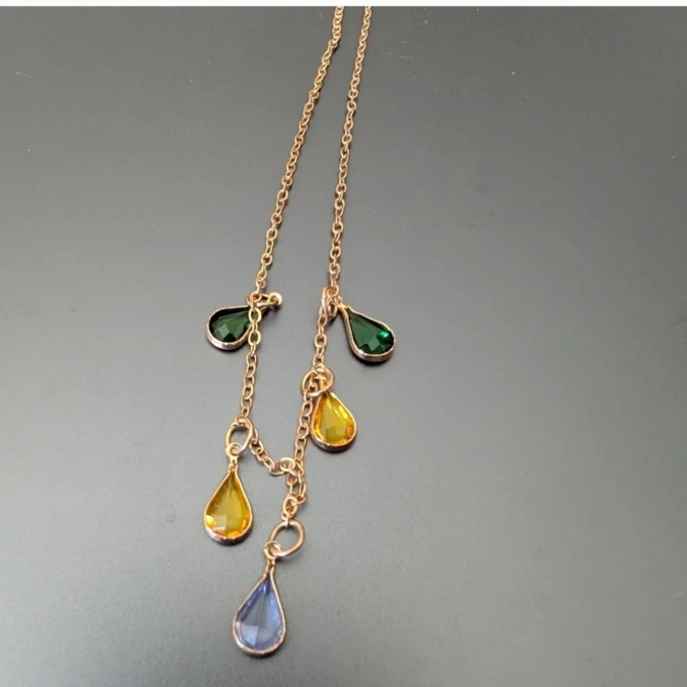 Elegant Triple-Strand Necklace in Coppery Metal with Crystal Teardrops